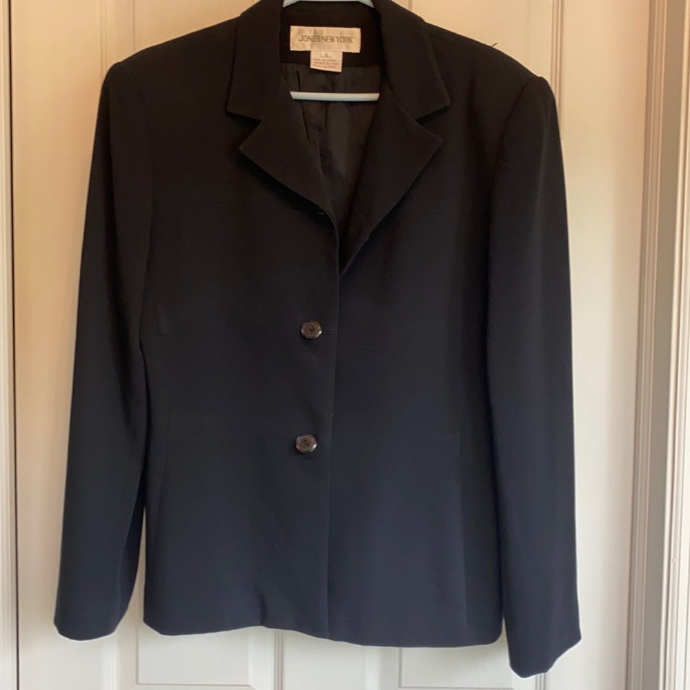 Navy blue long sleeve women’s suit jacket.